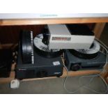 Three slide projectors etc.