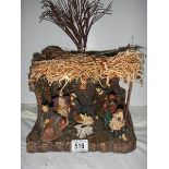 A boxed Nativity scene.