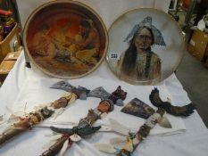 Three ornamental tomahawks and two American Indian collector's plates.