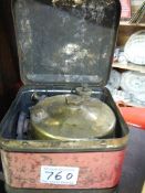 An old Primus stove in original tin.