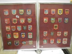 38 cloth badges in two frames, glazed.