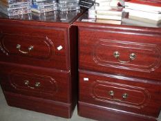 A pair of mahogany effect bedside chests. Collect only.