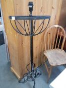 A wrought iron plant stand and a wall mounting plant stand.