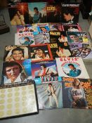 Approximately 20 Elvis Presley LP records.