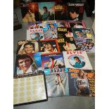 Approximately 20 Elvis Presley LP records.