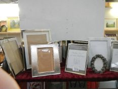 A mixed lot of photo frames.