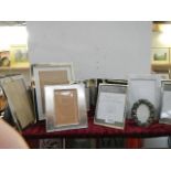 A mixed lot of photo frames.