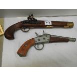 Two ornamental pistols.