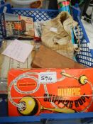 A box of vintage toys including skipping rope, marbles etc.