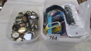 A quantity of watch parts and new watch straps.