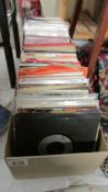 Two boxes of 45 rpm records (some missing sleeves).