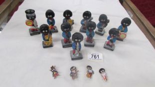 A collection of Robertson's jam band figures, A Lollipop man and 4 badges.