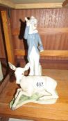 A Casades figure of a clown and a Lladro style deer, both made in Spain.