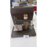 A cased 'Little Betty' vintage child's sewing machine.