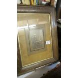 An oak framed and glazed photograph of an elderly lady reading.