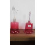 Two Victorian cranberry glass bells (one a/f, has repair to handle and silver collar added).