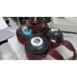 Two pairs of lawn bowls.