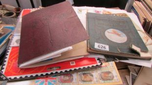 A mixed lot of postage stamps including two small albums.