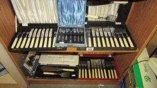 Six cased sets of cutlery.