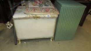 A Lloyd Loom linen bin, a storage stool and a tapestry cushion.