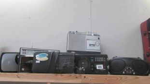 A mixed lot of portable radios.