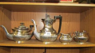 A four piece silver plate tea set.