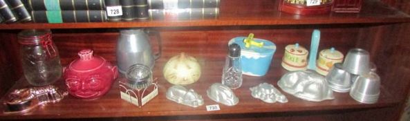 A mixed lot of kitchenalia including jelly moulds, sugar sifter, vintage cookie cutters etc.