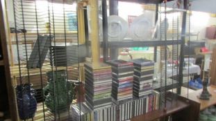 Two CD racks together with a good lot of CD's including country, classical etc.