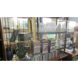 Two CD racks together with a good lot of CD's including country, classical etc.