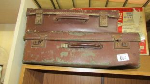 Two vintage suitcases.