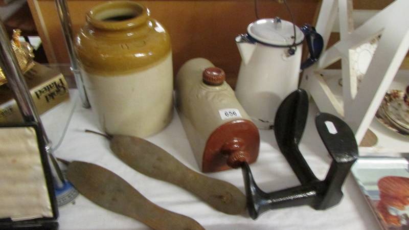 An enamel lidded jug, a stoneware jar, a stone ware foot warmer, shoe lasts etc.