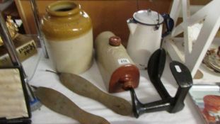 An enamel lidded jug, a stoneware jar, a stone ware foot warmer, shoe lasts etc.