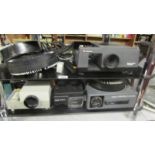 A Kodak slide projector and three others.