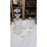 A cut and engraved glass decanter (chip to base) and a cut and engraved glass goblet.