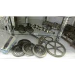 A quantity of cast iron 4" gauge line steam loco wheels and other items.