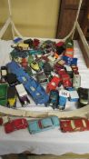 A mixed lot of play worn die cast vehicles.