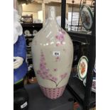 A tall pink Chinese style vase