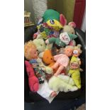 A mixed lot of soft toys and dolls.