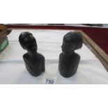 A pair of hardwood female busts.