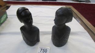 A pair of hardwood female busts.