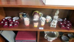 A mixed lot including miniature character jugs, boxed thimbles,