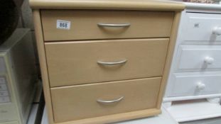 A three drawer bedroom chest.