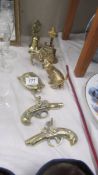 A quantity of brass ornaments including cat, horse, pistols etc.