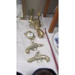 A quantity of brass ornaments including cat, horse, pistols etc.