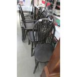A set of six wheel back kitchen chairs,