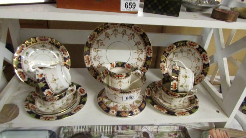 16 pieces of vintage tea ware including teapot stand.