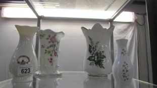 Four assorted vases including Donegal and Tara, Ireland examples.