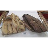 Two vintage baseball mitten gloves by Spalding & Wilson.