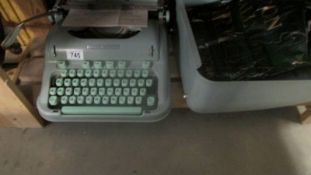 A vintage Hermes 3000 typewriter.
