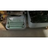 A vintage Hermes 3000 typewriter.